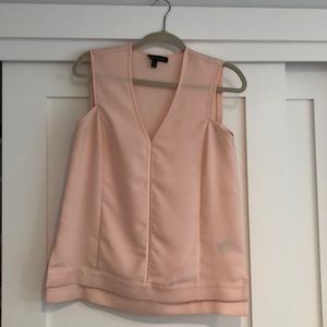 Pink sleeveless blouse